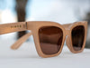 Luci Tan by TINTS Eyewear. Glossy beige frame, brown Lenses